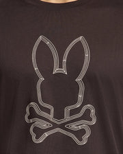 Introducing the Psycho Bunny men's graphic tee: the MENS MONARC FRONT BUNNY GRAPHIC TEE - B6U211E200 in black Pima cotton, featuring a raised-printed bunny head above two crossed bones, expertly blending comfort with edgy style.