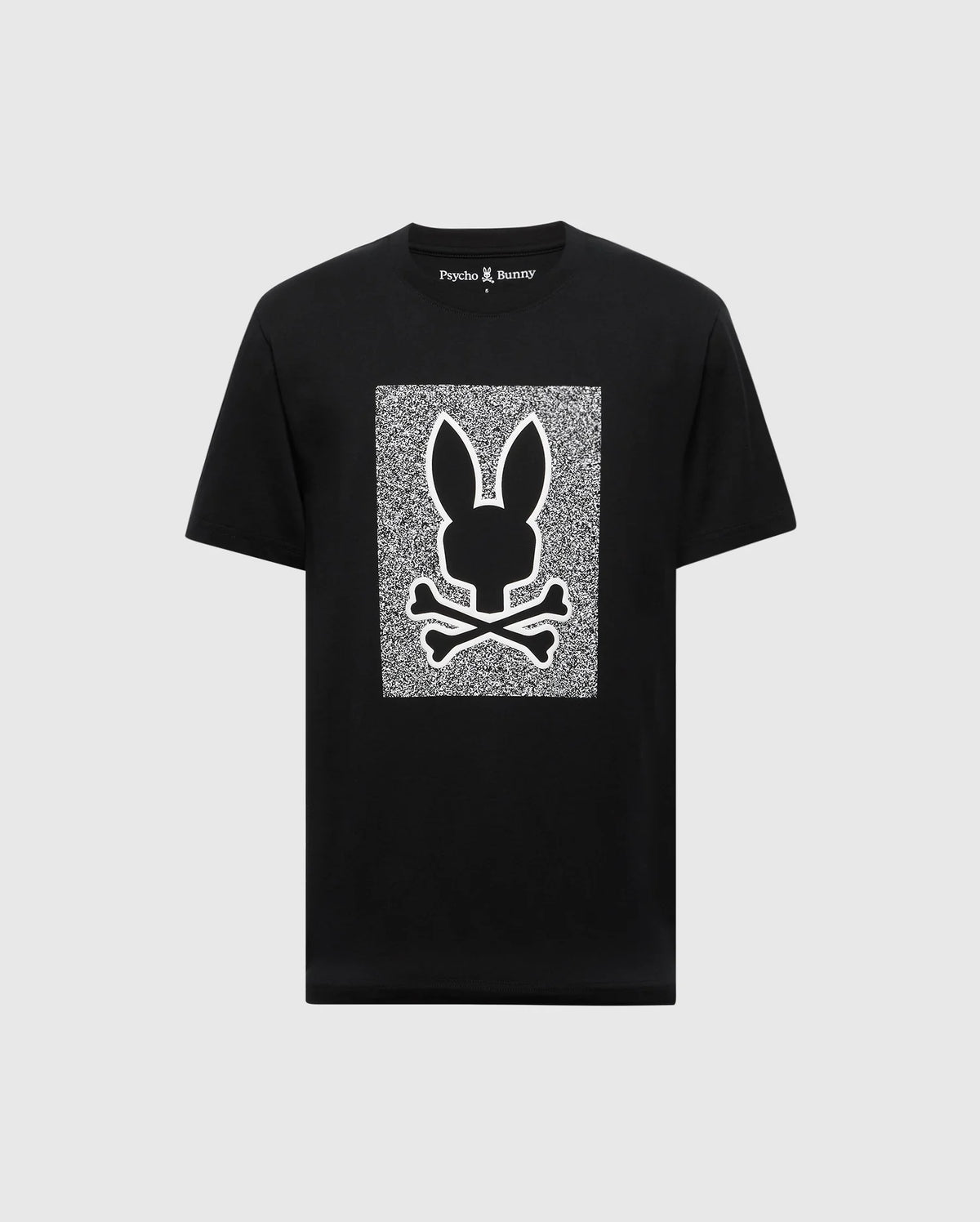 The Psycho Bunny MENS ROCKTON GRAPHIC TEE - B6U247C200 is a black T-shirt made from soft, 100% Pima cotton. It features a white geometric pattern with a bunny head and crossbones in the center with static-like texture, and "Psycho Bunny" text on the collar, crafted in Peru for top quality and comfort.