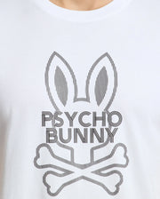 The MENS DUMON GRAPHIC TEE - B6U271E200 by Psycho Bunny is made from Premium Pima Cotton and showcases a stylized graphic of a bunny with crossbones underneath, elegantly accompanied by the "Psycho Bunny" text.
