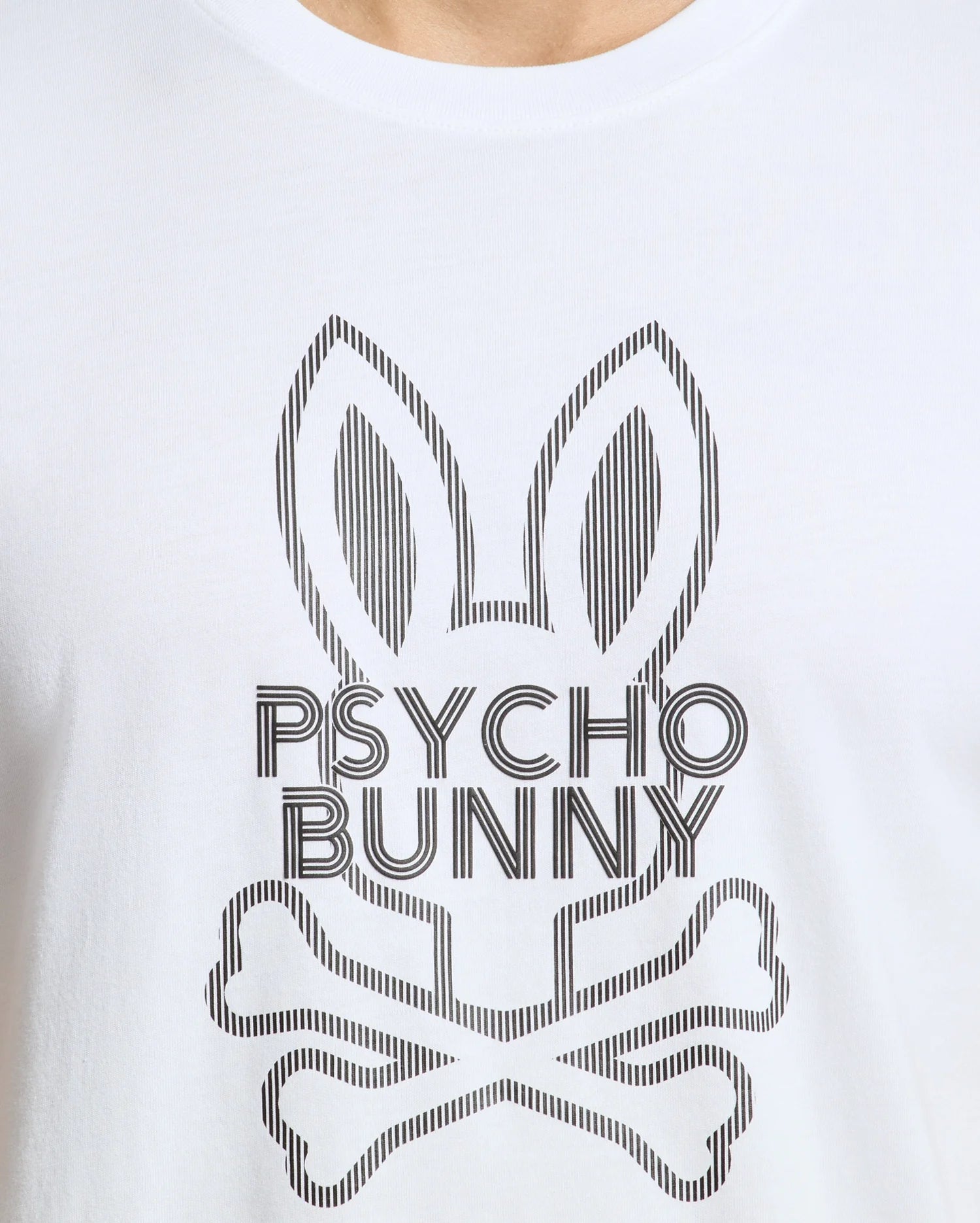 The MENS DUMON GRAPHIC TEE - B6U271E200 by Psycho Bunny is made from Premium Pima Cotton and showcases a stylized graphic of a bunny with crossbones underneath, elegantly accompanied by the "Psycho Bunny" text.