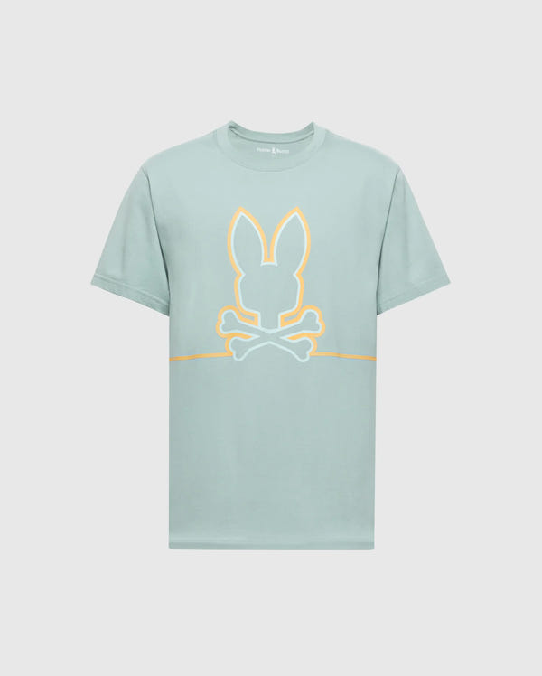The MENS DACANO FRONT GRAPHIC TEE - B6U314E200 by Psycho Bunny, features a stylized graphic with bunny ears above crossed bones outlined in orange, centered on the front of a light green, regular fit shirt. This comfort-forward design stands out against a plain white background.