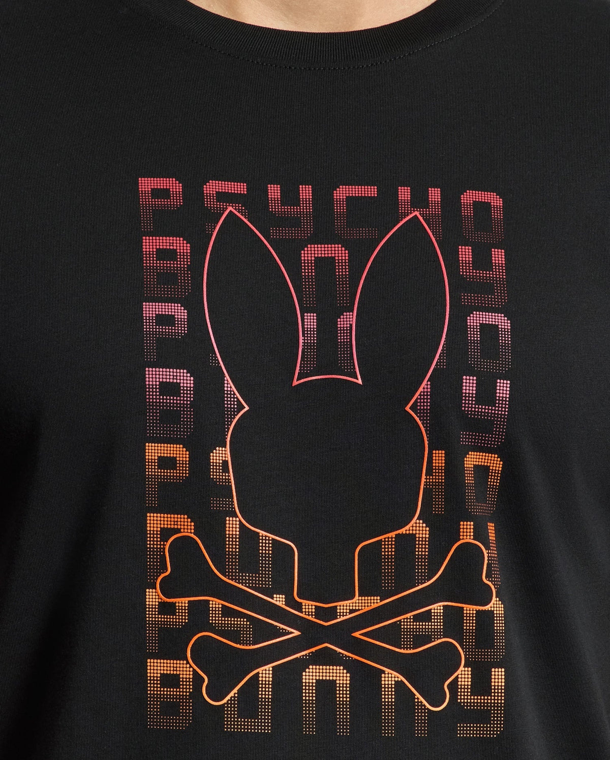 The MENS CORTES GRAPHIC TEE - B6U328E200 by Psycho Bunny features a lightweight design crafted from premium men's Pima cotton. It displays a striking black graphic of a bunny face with crossbones, highlighted with red and orange outlines. The backdrop showcases the word "PSYCHO" repeated vertically in a captivating purple-to-orange gradient, enhancing the bold allure of this stylish men's tee.