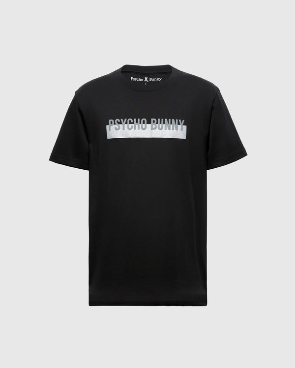 The MENS BROOKPORT GRAPHIC TEE - B6U362E200 by Psycho Bunny is a men's black T-shirt made from premium Pima cotton, showcasing the distinctive "Psycho Bunny" logo across the chest in light lettering. It is set against a plain gray backdrop.