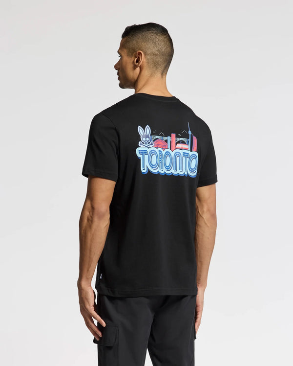 A person wears the Psycho Bunny MENS TORONTO TEE - B6U383F200, made of soft Pima cotton. It has a vibrant hometown hero graphic with "Toronto," a rabbit, and city landmarks on the back, perfectly showcased as they face away.