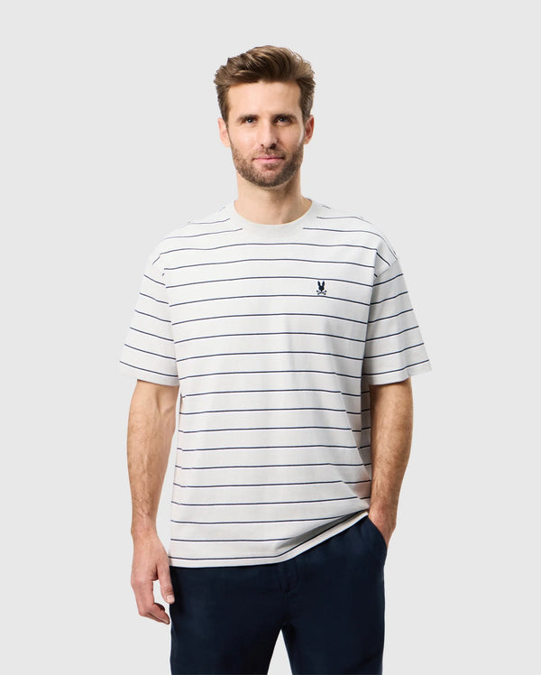 Front view of a male model wearing the mens pima cotton alton stripe heavy weight tee with one hand in his pocket 