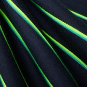Close-up image of fabric with a dark blue background and vibrant diagonal stripes in shades of green and yellow. The heavyweight jersey fabric, featuring 90s-inspired two-tone stripes, appears soft and slightly gathered, highlighting the texture and pattern of the Psycho Bunny MENS ALTON STRIPE OVERSIZED TEE - B6U409C200.