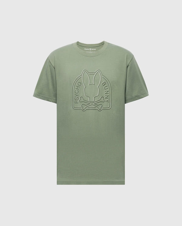 The Mens Melbourne Graphic Tee by Psycho Bunny features a large rabbit with crossbones emblem and "Psycho Bunny" text on the front. It's eco-friendly, crafted from Peruvian Pima cotton, in green with a light gray background.