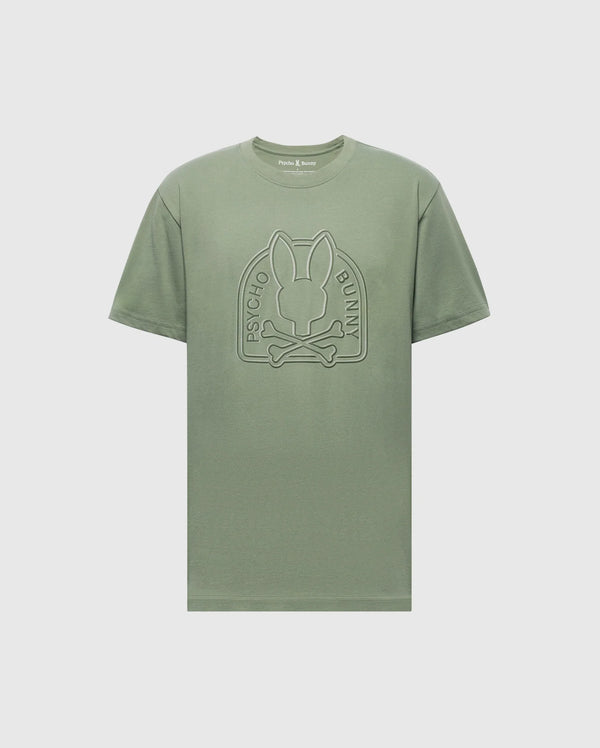The Mens Melbourne Graphic Tee by Psycho Bunny features a large rabbit with crossbones emblem and "Psycho Bunny" text on the front. It's eco-friendly, crafted from Peruvian Pima cotton, in green with a light gray background.