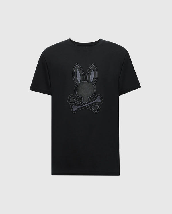 The Psycho Bunny MENS NEW CASTLE GRAPHIC TEE (B6U415F200) features a stylized embroidered bunny head with crossbones on a black Pima cotton T-shirt against a plain white background.