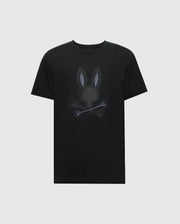 The Psycho Bunny MENS NEW CASTLE GRAPHIC TEE (B6U415F200) features a stylized embroidered bunny head with crossbones on a black Pima cotton T-shirt against a plain white background.