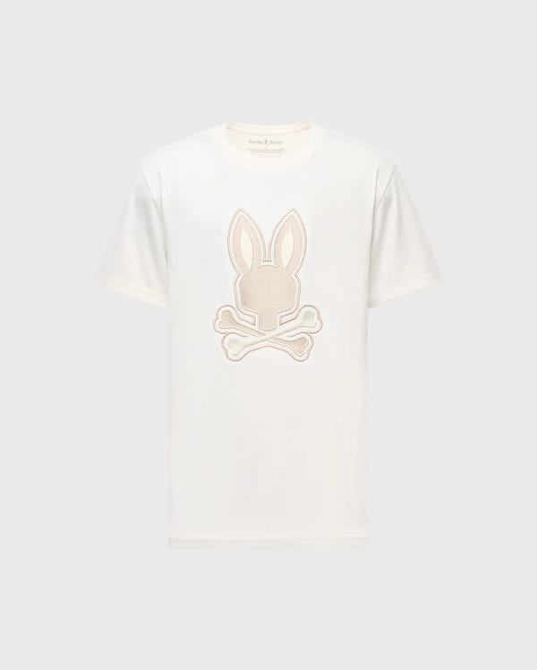 Check out the Psycho Bunny MENS NEW CASTLE GRAPHIC TEE, B6U415F200. This white Pima cotton T-shirt features an embroidered bunny head with ears and crossed bones in light beige, elegantly centered on the front.