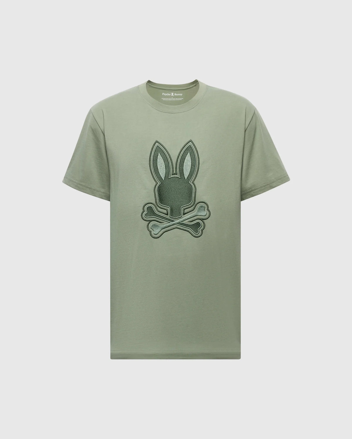 Explore the Psycho Bunny Mens New Castle Graphic Tee (B6U415F200) in green, made from luxurious Pima cotton, featuring a distinctive embroidered bunny skull and crossbones design on the front for an edgy touch.