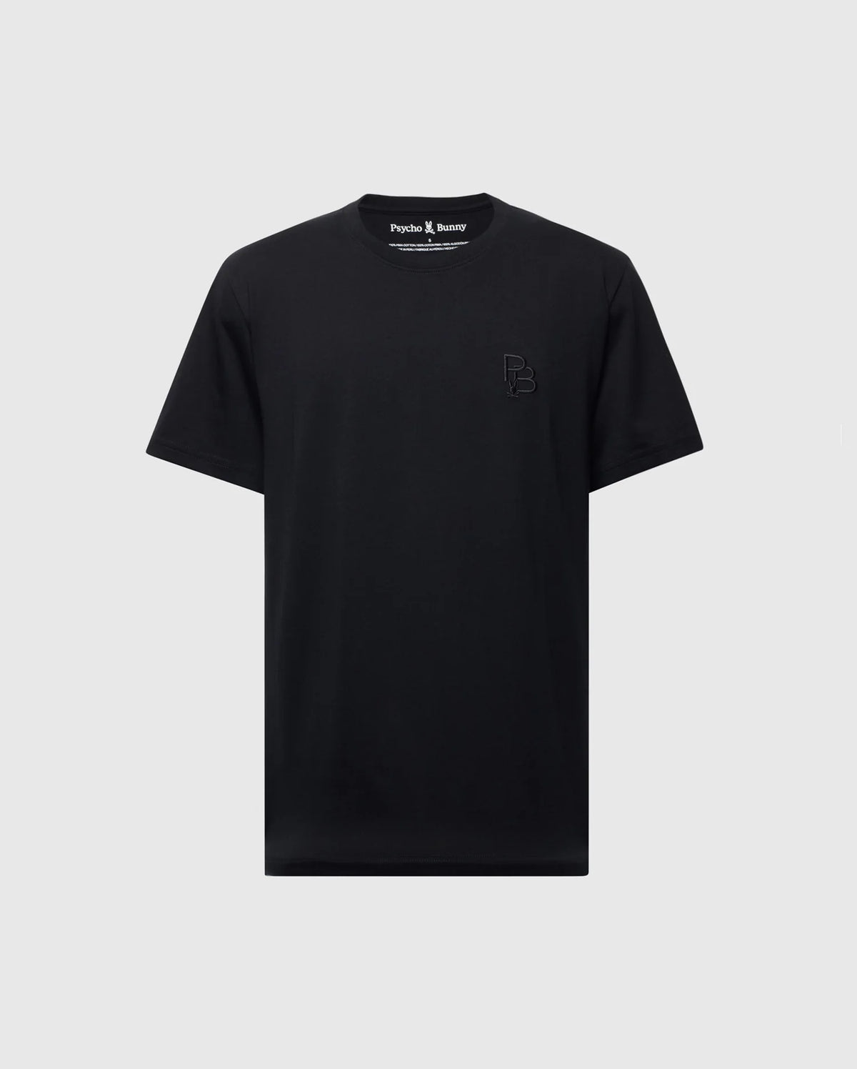 The Psycho Bunny MENS NICHOLSON PB CHEST GRAPHIC TEE - B6U416F200 is a black, regular fit T-shirt made from soft Pima cotton. It features subtle embroidered "PB" initials on the upper left and is displayed against a light gray background.