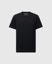 The Psycho Bunny MENS NICHOLSON PB CHEST GRAPHIC TEE - B6U416F200 is a black, regular fit T-shirt made from soft Pima cotton. It features subtle embroidered "PB" initials on the upper left and is displayed against a light gray background.