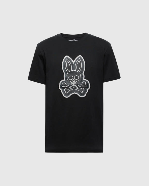 The MENS SYDNEY GRAPHIC TEE (B6U508F200) by Psycho Bunny is a black, regular fit T-shirt. Crafted from soft Pima cotton, it features a vivid white outlined cartoon bunny head with long ears and teeth above crossed bones on a plain white background.