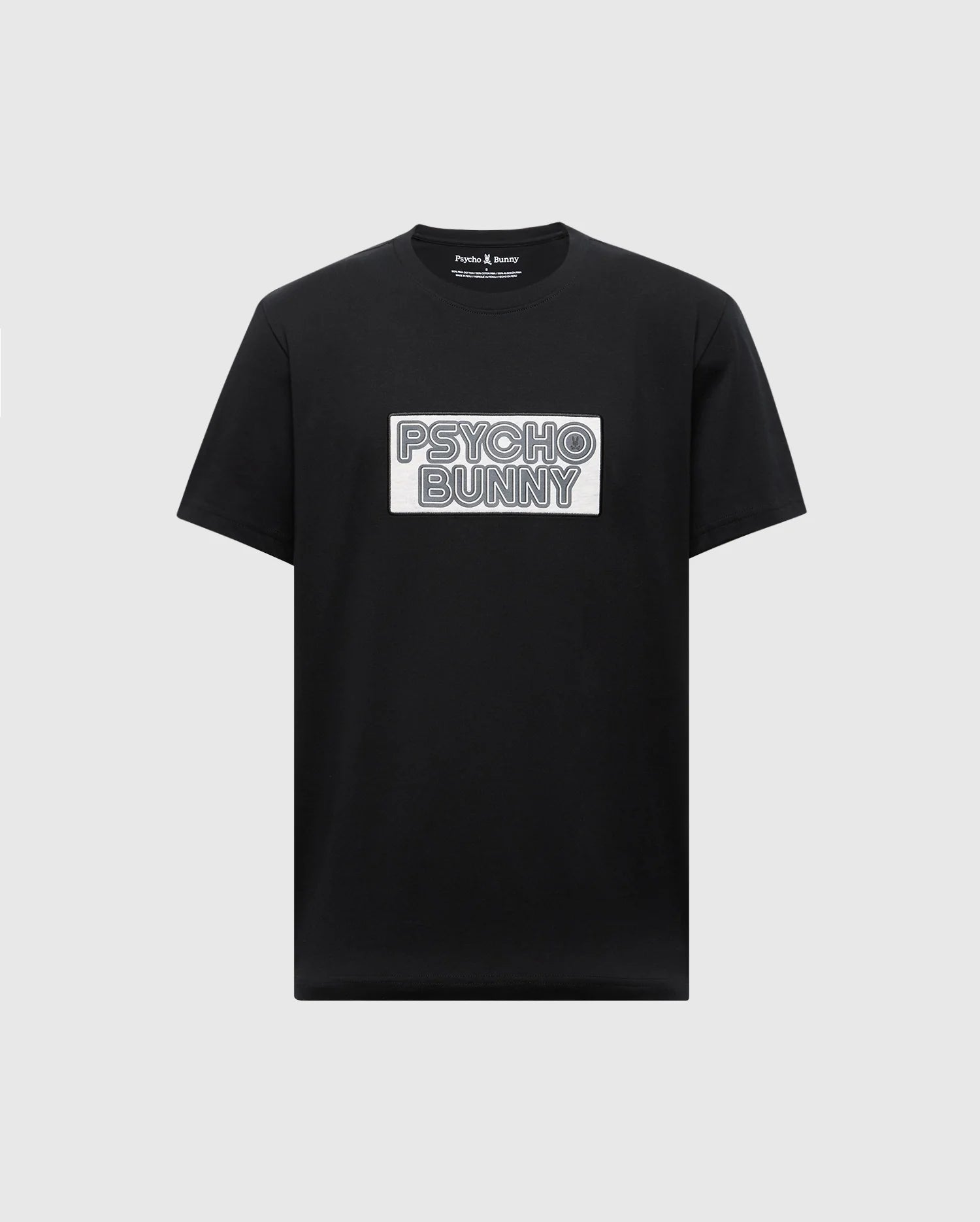The MENS SYDNEY WORDMARK GRAPHIC TEE - B6U510F200 by Psycho Bunny is a black Pima cotton T-shirt with a chest white patch featuring "PSYCHO BUNNY" in bold, outlined letters, offering a sleek and stylish touch.