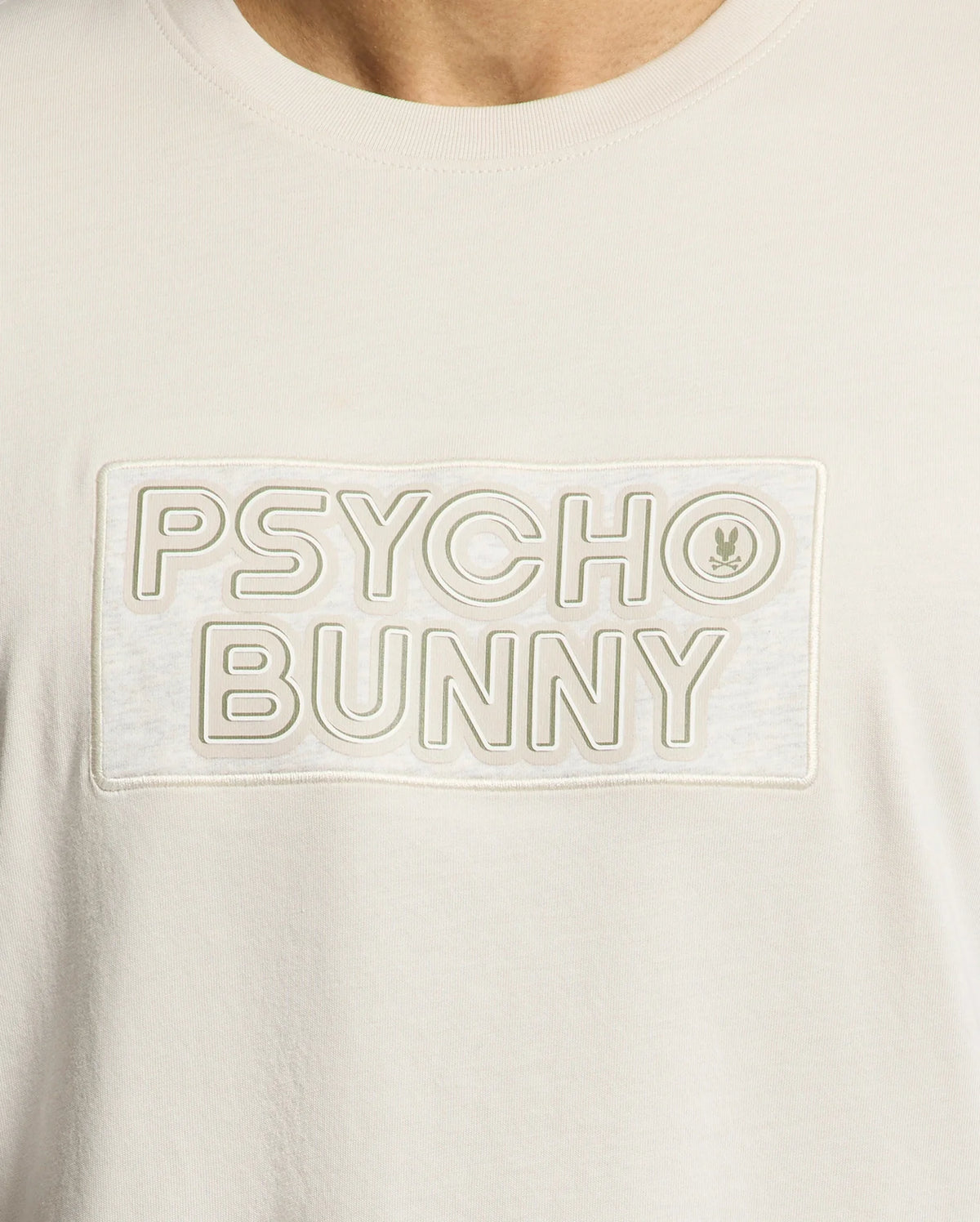 The MENS SYDNEY WORDMARK GRAPHIC TEE by Psycho Bunny features soft Pima cotton, a sleek "Psycho Bunny" wordmark in a rectangle, and a small bunny logo next to "Bunny.