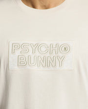 The MENS SYDNEY WORDMARK GRAPHIC TEE by Psycho Bunny features soft Pima cotton, a sleek "Psycho Bunny" wordmark in a rectangle, and a small bunny logo next to "Bunny.