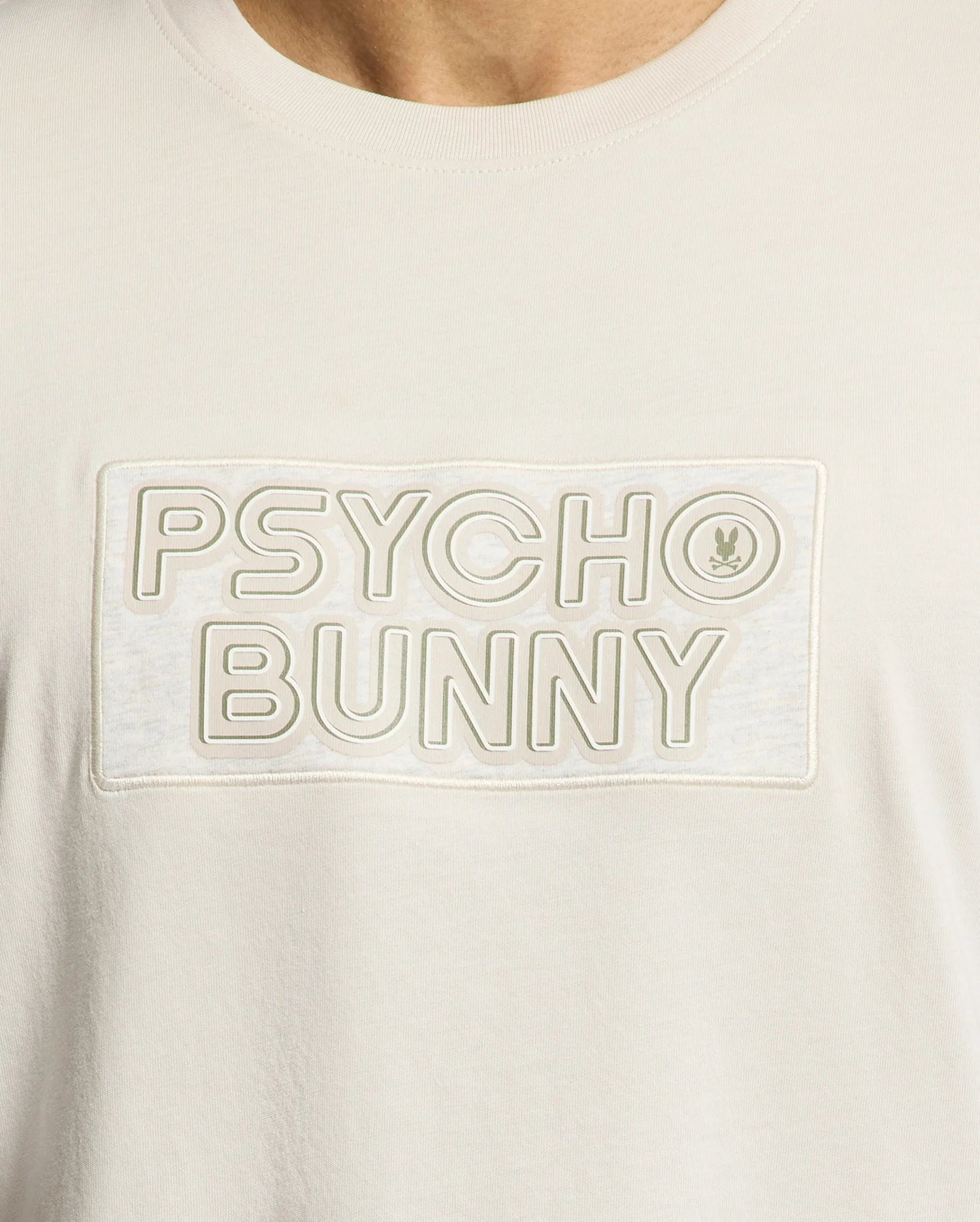 The MENS SYDNEY WORDMARK GRAPHIC TEE by Psycho Bunny features soft Pima cotton, a sleek "Psycho Bunny" wordmark in a rectangle, and a small bunny logo next to "Bunny.