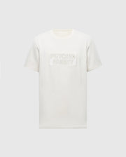 The MENS SYDNEY WORDMARK GRAPHIC TEE - B6U510F200 by Psycho Bunny is a plain white Pima cotton shirt with "Psycho Bunny" embossed on the chest. It features Peruvian craftsmanship, a classic round neckline, and short sleeves, set against a light grey background.