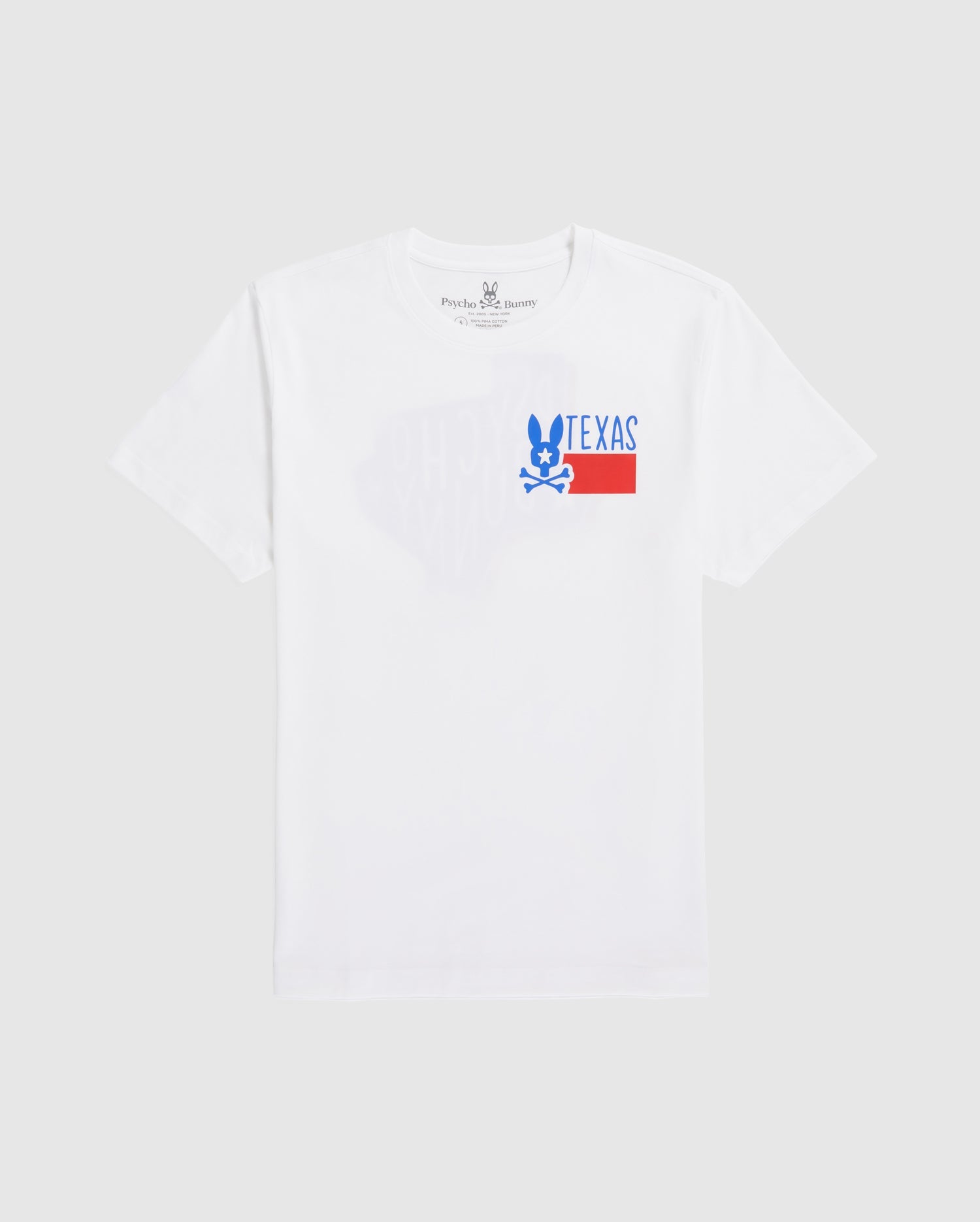 A plain white men's Psycho Bunny Texas tee laid flat, featuring a graphic print with the word "TEXAS" in block letters and a stylized blue and red design underneath, positioned slightly off-center towards the left.