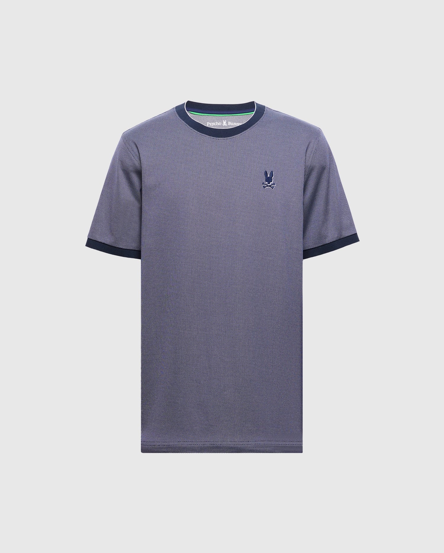 The Psycho Bunny MENS MACKAY JACQUARD FASHION TEE (B6U576F200) is a plain blue Pima cotton T-shirt with a small black rabbit logo on the left chest, featuring black trim on the collar and sleeves, set against a light gray background for a timeless look.