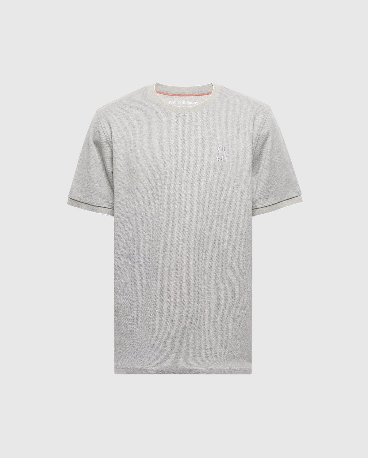 The MENS MACKAY JACQUARD FASHION TEE by Psycho Bunny is a gray Pima cotton T-shirt with short sleeves and an embroidered chest Bunny on the left, set against a plain white background.