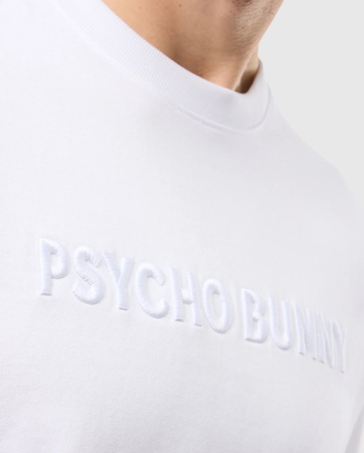 close up of complete front wordmark graphic of the pima cotton windcrest heavy weight tee in white