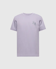 The Psycho Bunny MENS ELLIOT FRONT BACK GRAPHIC TEE - B6U605F200 is a regular fit light purple t-shirt made of soft Pima cotton. It features a small embroidery of two abstract open hands on the left chest and is displayed flat on a white background.