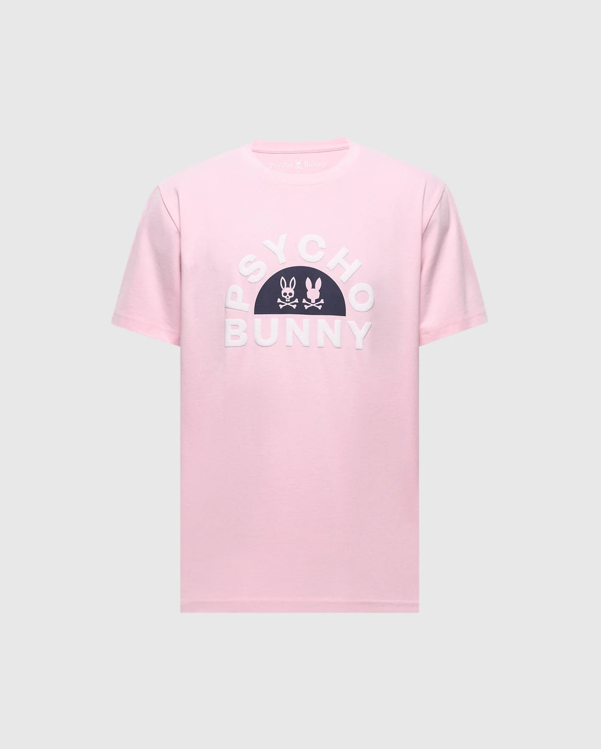Introducing the MENS GOLDIE GRAPHIC TEE by Psycho Bunny: A pink Pima Cotton tee with "PSYCHO BUNNY" in bold white letters and a black semi-circle displaying a striking Bunny Graphic with crossbones.