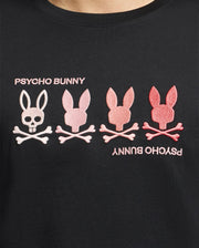 Close-up of the Men's Oceania Embroidered Graphic Tee by Psycho Bunny, featuring embroidered bunny skull graphics in black Pima cotton. Retro vibes with pink and white shades surround the "PSYCHO BUNNY" text, positioned right-side up and upside down above and below the logos.