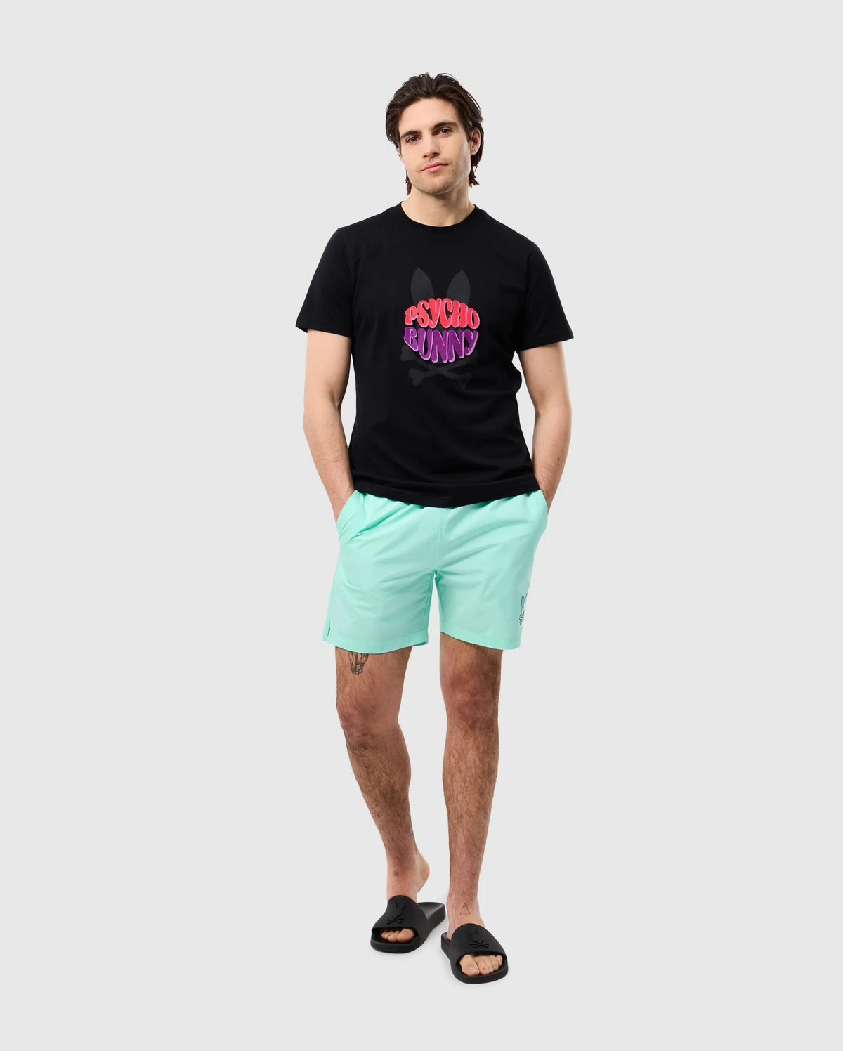 head to toe view of a male model wearing the pima cotton preston graphic tee in black