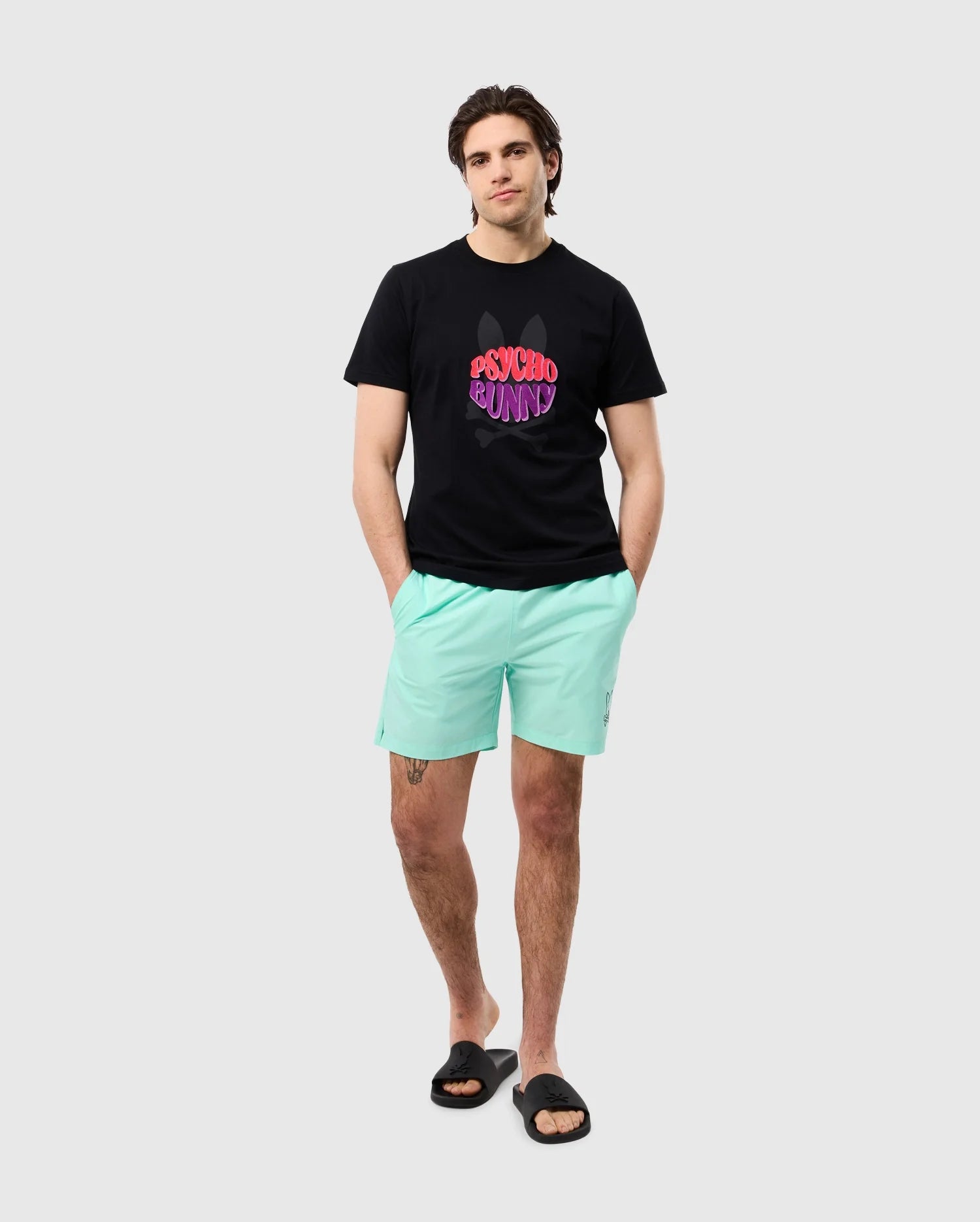 head to toe view of a male model wearing the pima cotton preston graphic tee in black