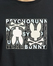 The Psycho Bunny MENS GOLD COAST GRAPHIC TEE - B6U631F200, made from premium Pima cotton in a classic fit, features two stylized rabbit logos with crossbones and "PSYCHO BUNNY" in alternating black and white letters, combining unique design with exceptional craftsmanship.