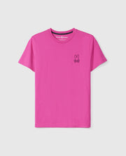 The MENS PEARLAND BACK GRAPHIC TEE - B6U632C200 by Psycho Bunny is a vibrant pink shirt made from soft Pima cotton, featuring a small embroidered bunny logo with crossed bones below it on the upper left side of the chest.
