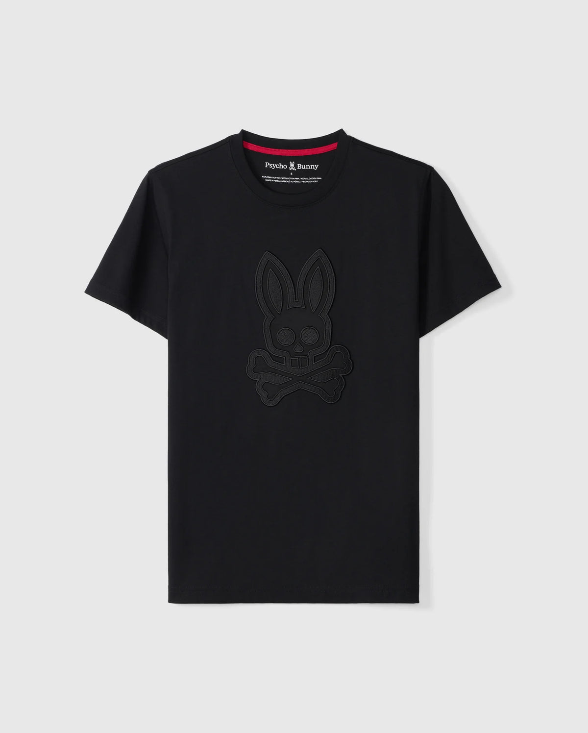 The MENS MALTON GRAPHIC TEE - B6U795D200 by Psycho Bunny is a black short-sleeve T-shirt made from luxurious Pima cotton. It showcases an embossed bunny with crossbones design on the front, featuring a contrasting red lining on the neckline and a small "Psycho Bunny" tag. Made in Peru, this stylish T-shirt is displayed against a plain white background.