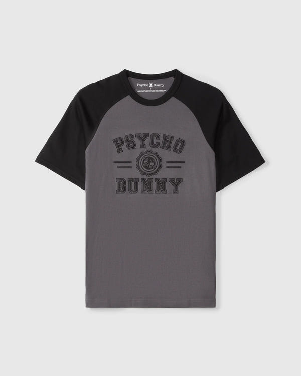 The Psycho Bunny MENS LONDON RAGLAN GRAPHIC TEE - B6U896D200 features gray and black short sleeves, "Psycho Bunny" text on the front with a small bunny logo in between. Made of premium Pima cotton, it combines comfort and style perfectly.