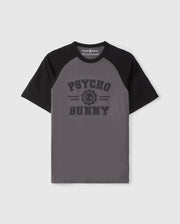 The Psycho Bunny MENS LONDON RAGLAN GRAPHIC TEE - B6U896D200 features gray and black short sleeves, "Psycho Bunny" text on the front with a small bunny logo in between. Made of premium Pima cotton, it combines comfort and style perfectly.
