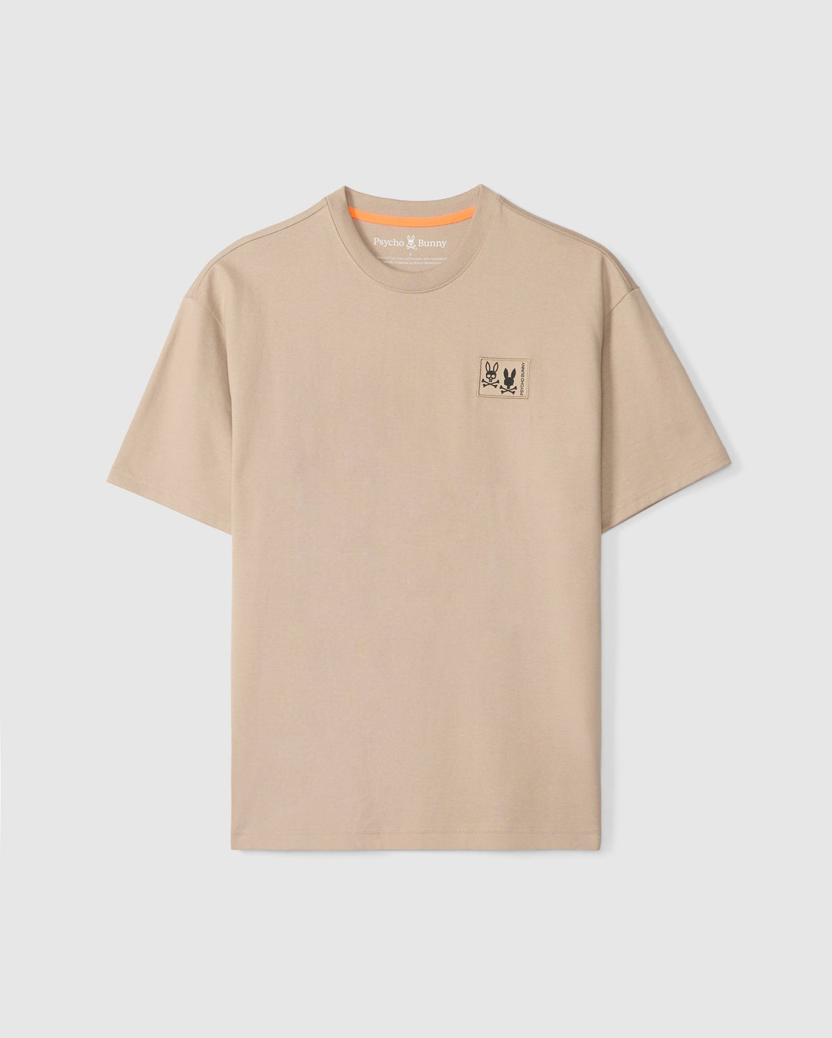 The Psycho Bunny MENS MONROE HEAVY WEIGHT RELAXED FIT TEE - B6U910D200 is a beige Pima cotton tee with a relaxed fit and crew neckline, featuring an embroidered bug emblem on the left chest.