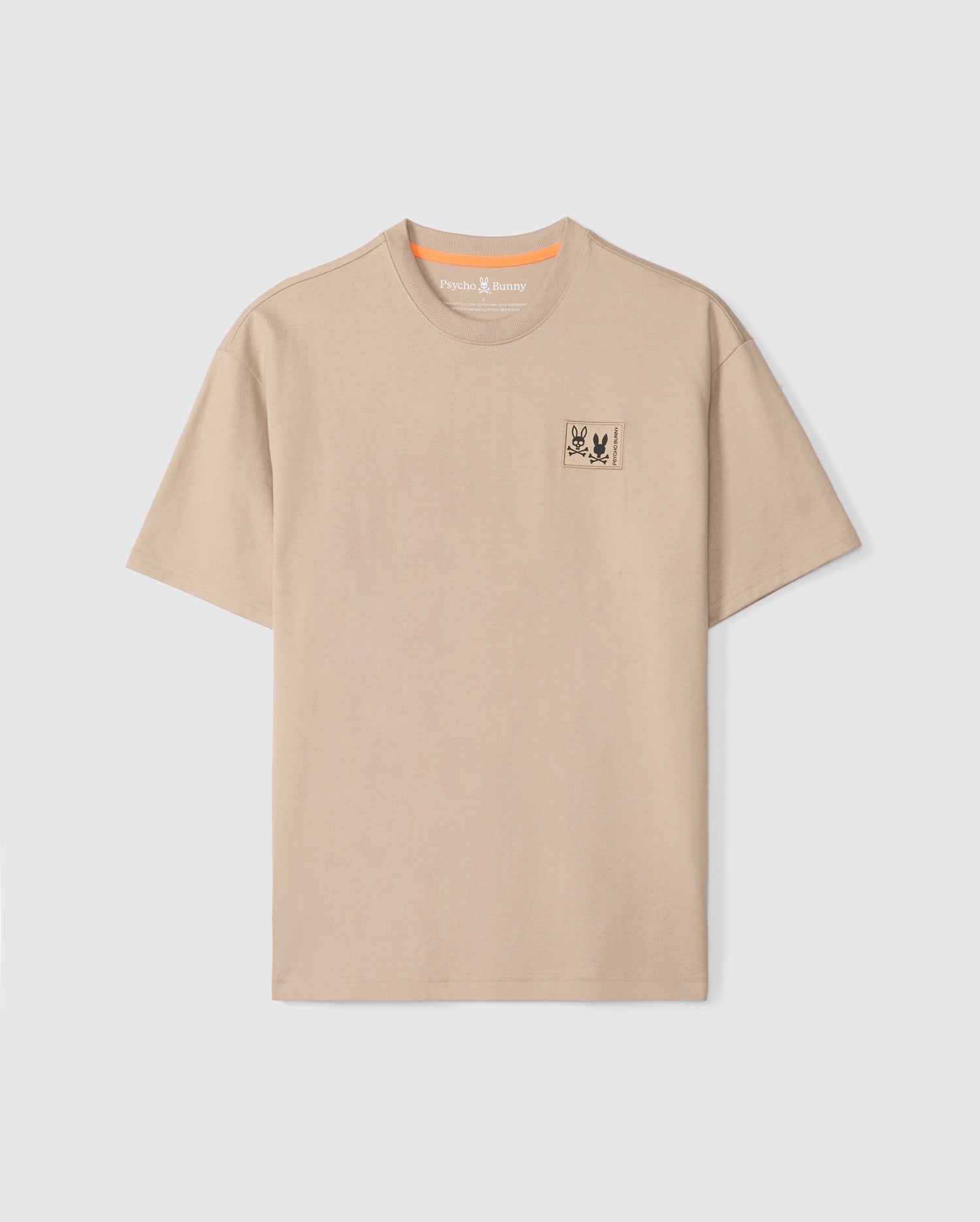 The Psycho Bunny MENS MONROE HEAVY WEIGHT RELAXED FIT TEE - B6U910D200 is a beige Pima cotton tee with a relaxed fit and crew neckline, featuring an embroidered bug emblem on the left chest.