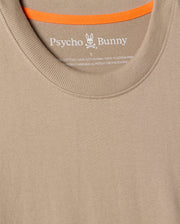 Close-up of the MENS MONROE HEAVY WEIGHT RELAXED FIT TEE in beige, by Psycho Bunny, made from soft Pima cotton. It features the brand name and logo on the inside neckline with an orange-trimmed inner collar, ideal for showcasing your casual style.