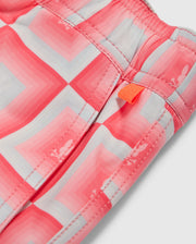 Close-up of a Psycho Bunny MENS UTICA SWIM TRUNK - B6W399B2SW featuring a pink and white all-over print with a visible orange zipper pull.