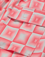 Close-up of a pink and white checked shirt with embroidered bunny motifs on the pocket, crafted from quick-drying fabric.