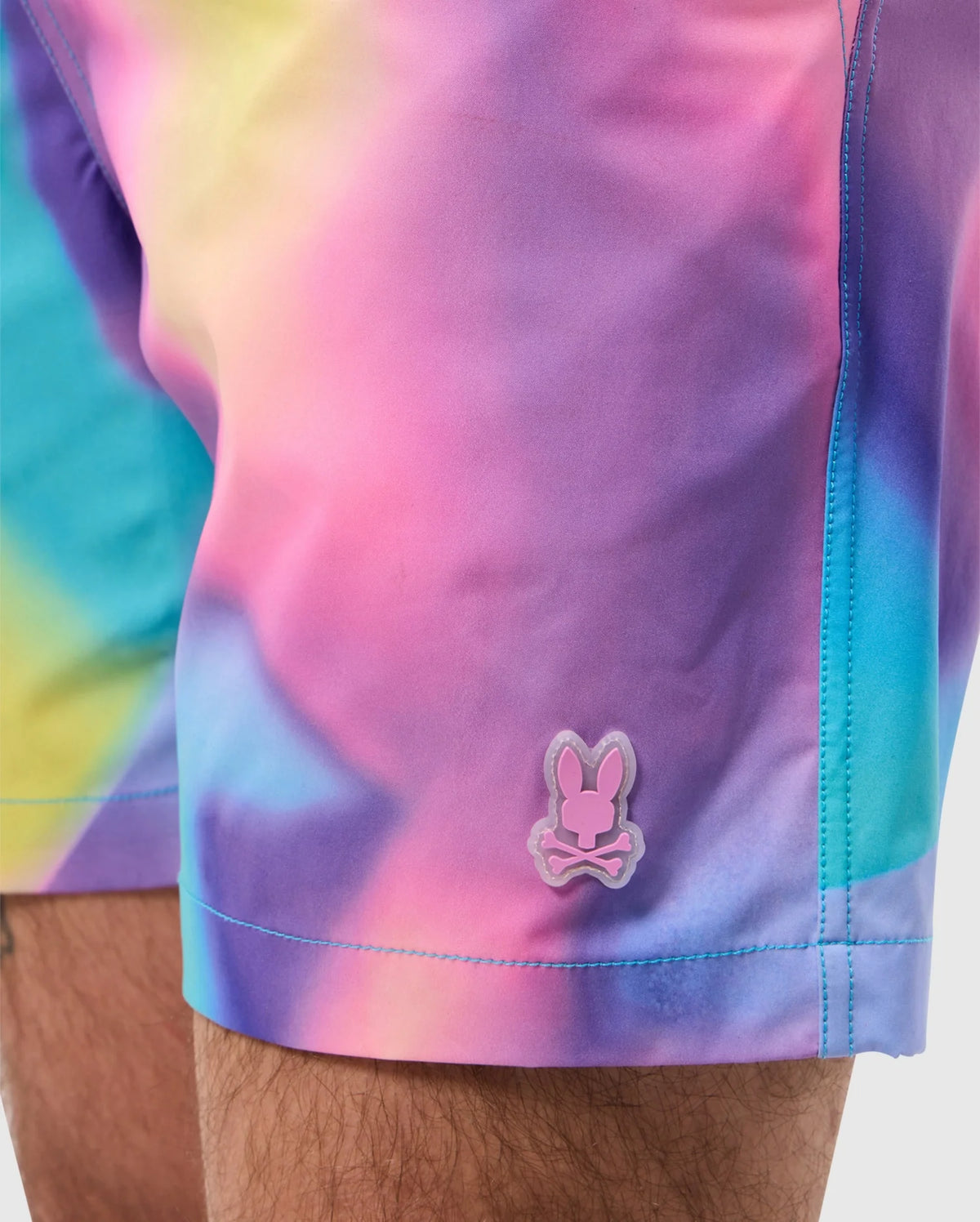 Close up of men's tyler print swim trunk in violet