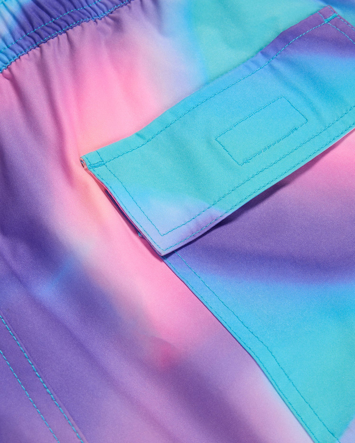 pocket detail of the men's tyler print swim trunk