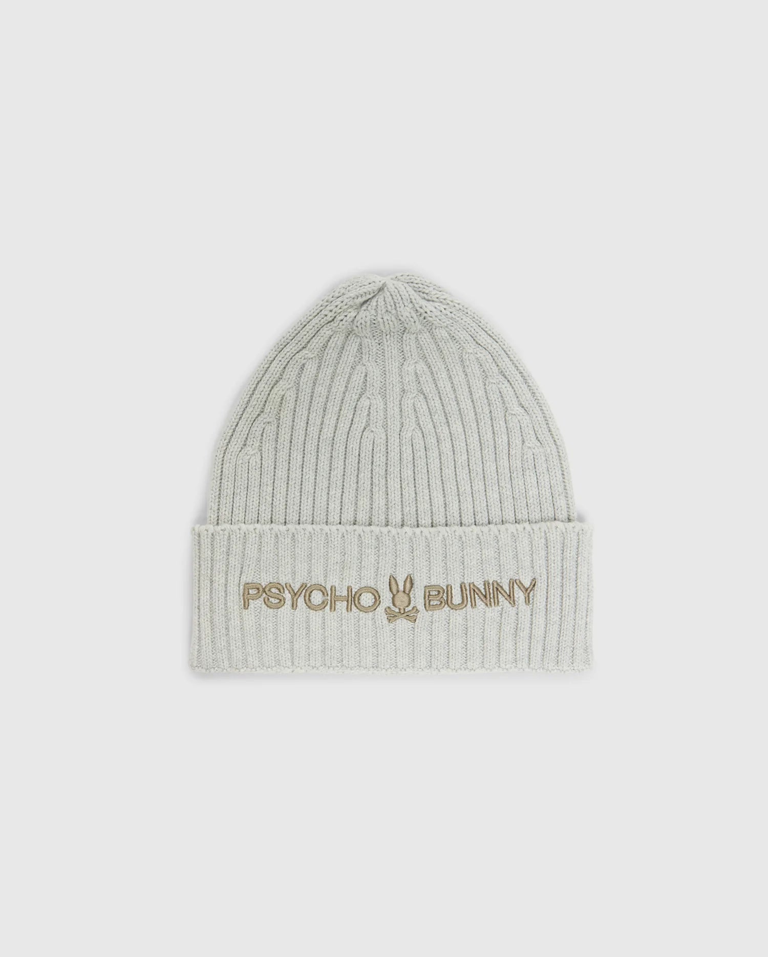 The MENS BEANIE AND SCARF BOX SET - B6X353E200 by Psycho Bunny includes a light gray ribbed beanie with "Psycho Bunny" and a bunny logo embroidered in gold on the folded brim. Crafted from premium 100% cotton, it provides both warmth and style.