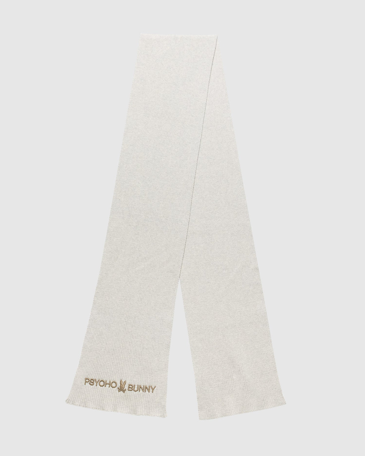 A light gray scarf from the Psycho Bunny MENS BEANIE AND SCARF BOX SET - B6X353E200 showcases the Psycho Bunny logo and text embroidered in the corner. This scarf highlights a simple, minimalist design and is photographed laid flat against a plain background.