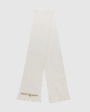 A light gray scarf from the Psycho Bunny MENS BEANIE AND SCARF BOX SET - B6X353E200 showcases the Psycho Bunny logo and text embroidered in the corner. This scarf highlights a simple, minimalist design and is photographed laid flat against a plain background.