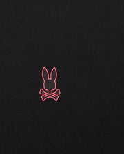 The BIG AND TALL TRAVIS TRACK JACKET by Psycho Bunny showcases a pink bunny head silhouette above crossed bones on a black background, using silicone heat transfer for depth and an ultra-sleek finish.