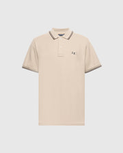 The Psycho Bunny Men's Big and Tall Monroe Pique Polo - B9K964D200 is a regular-fit, beige polo made from Pima cotton, featuring a buttoned collar with black stripes on the edges, short sleeves with striped cuffs, and an embroidered chest emblem.